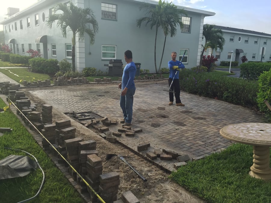Condo courtyard pavers restored with new border course