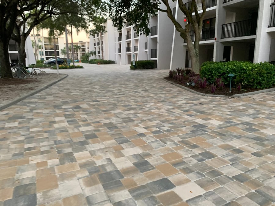 Condominium courtyard drive in blended tumbled pavers