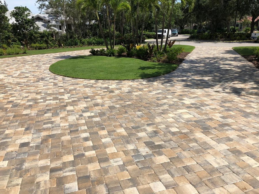 Circular paver drive court with a center grass island