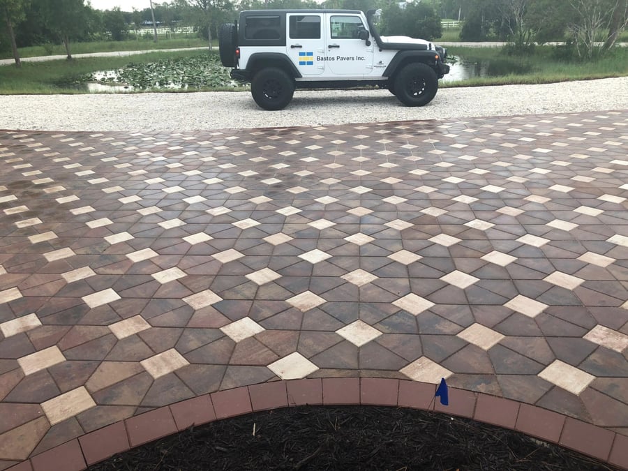 Decorative mosaic pattern paver driveway with Bastos Pavers Jeep