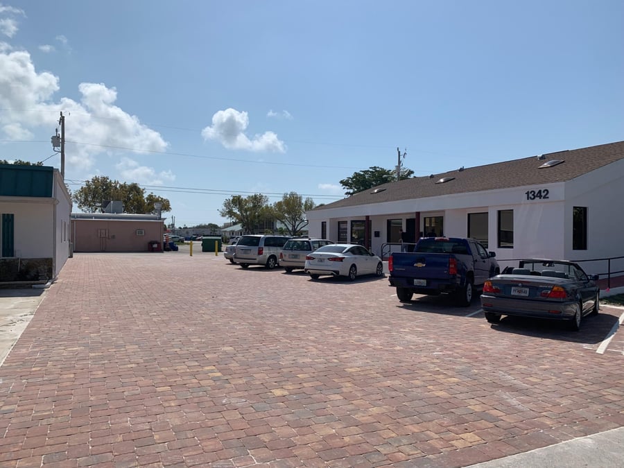Office plaza parking lot finished in blended clay pavers