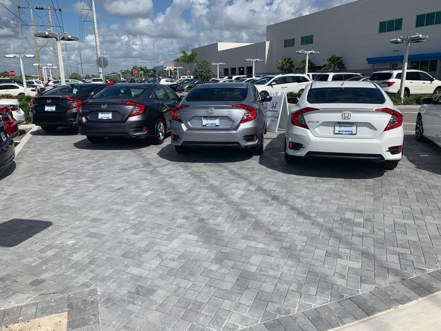 Paver display lot at a Honda dealership with new vehicles
