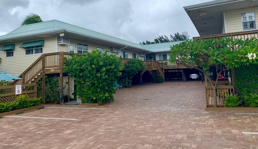 Red brick paver parking area at an island cottage complex