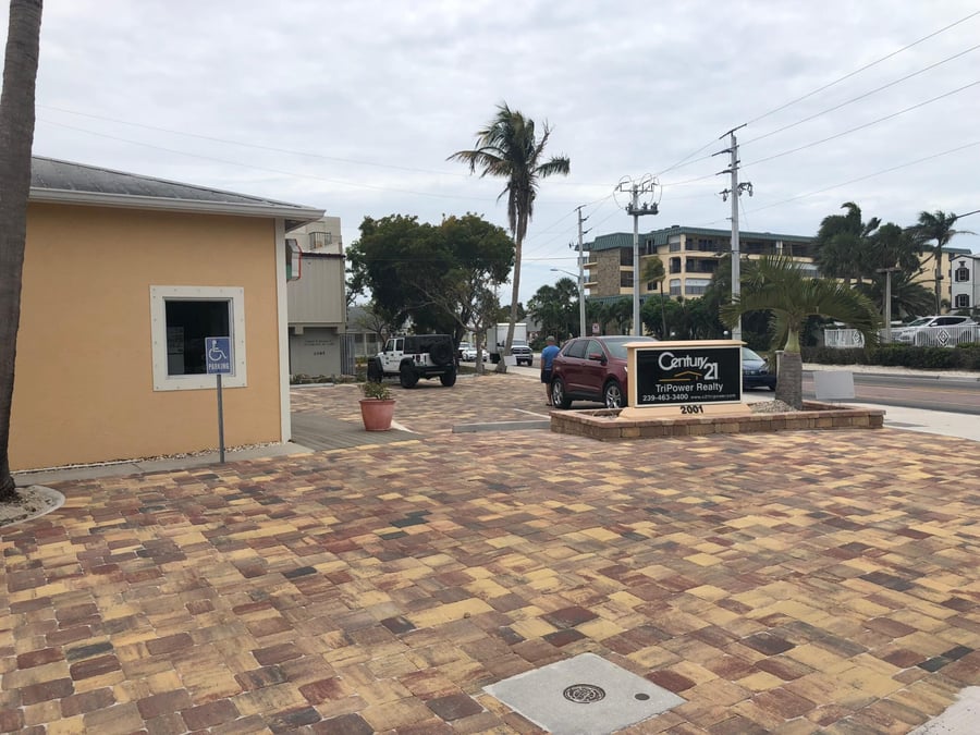 Warm-toned paver parking lot at a realty office on the beach