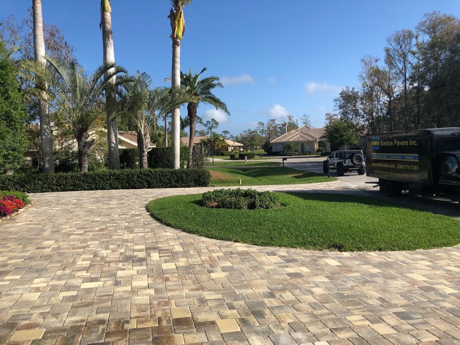 Circular paver driveway in a golf community with the Bastos Pavers truck
