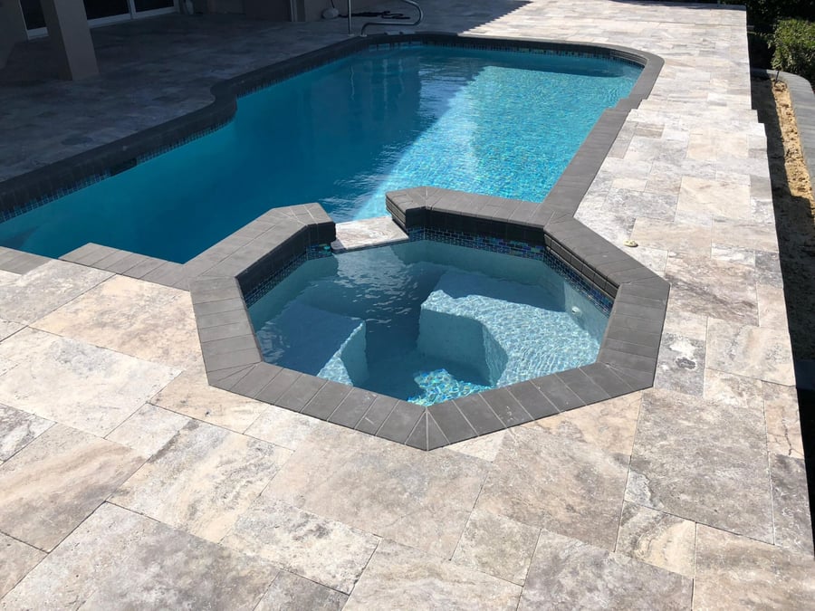 Silver travertine pool deck with octagonal spa