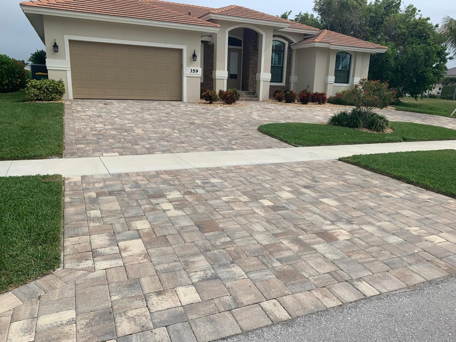 Paver driveway with apron rebuilt around the city sidewalk