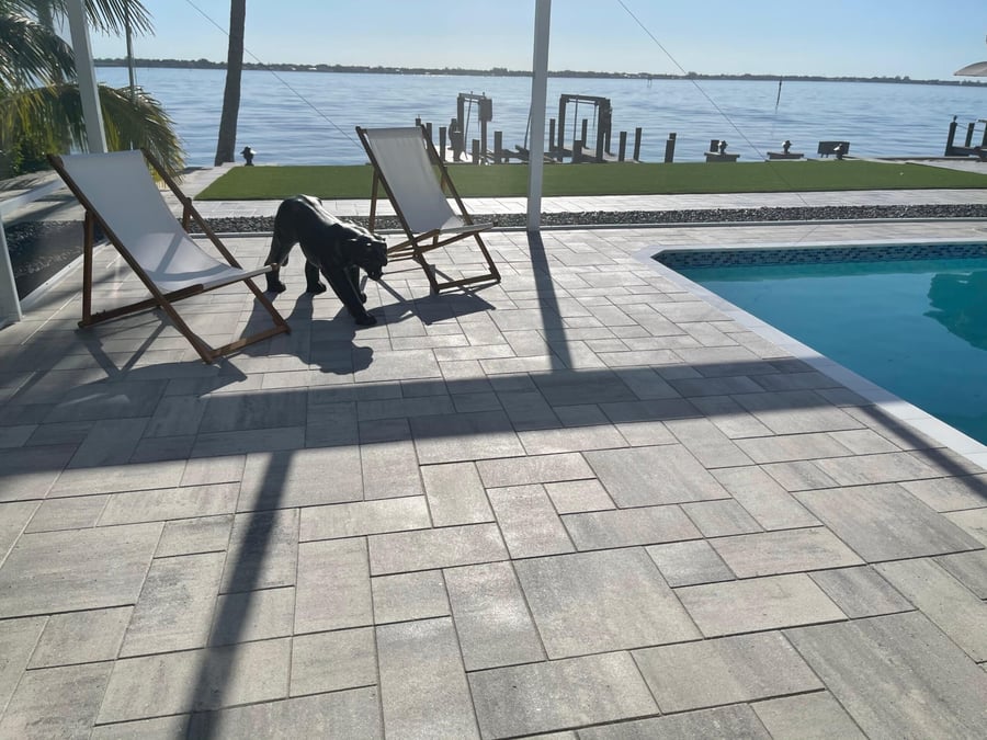 Gray plank paver pool deck overlooking the river