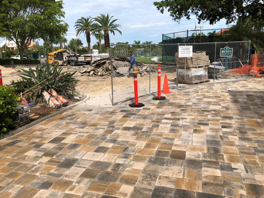 New tumbled paver plaza under construction at a beach club