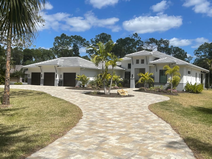 Curved paver driveway with center island at a new estate
