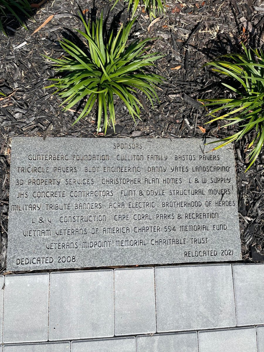 Veterans memorial sponsor plaque set into gray pavers listing Bastos Pavers