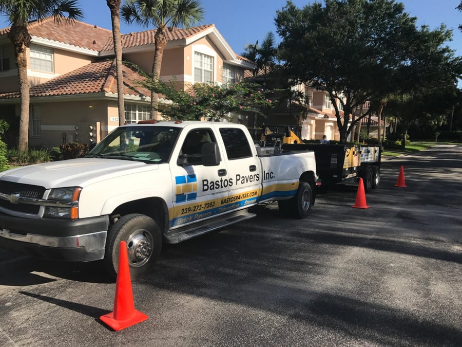 Bastos truck and trailer coned off for a community driveway repair