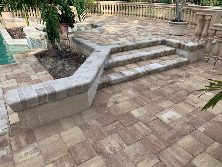 Estate pool terrace with paver steps and seat walls