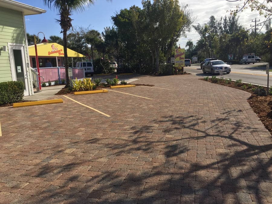 Restaurant parking lot paved in blended pavers with striped stalls