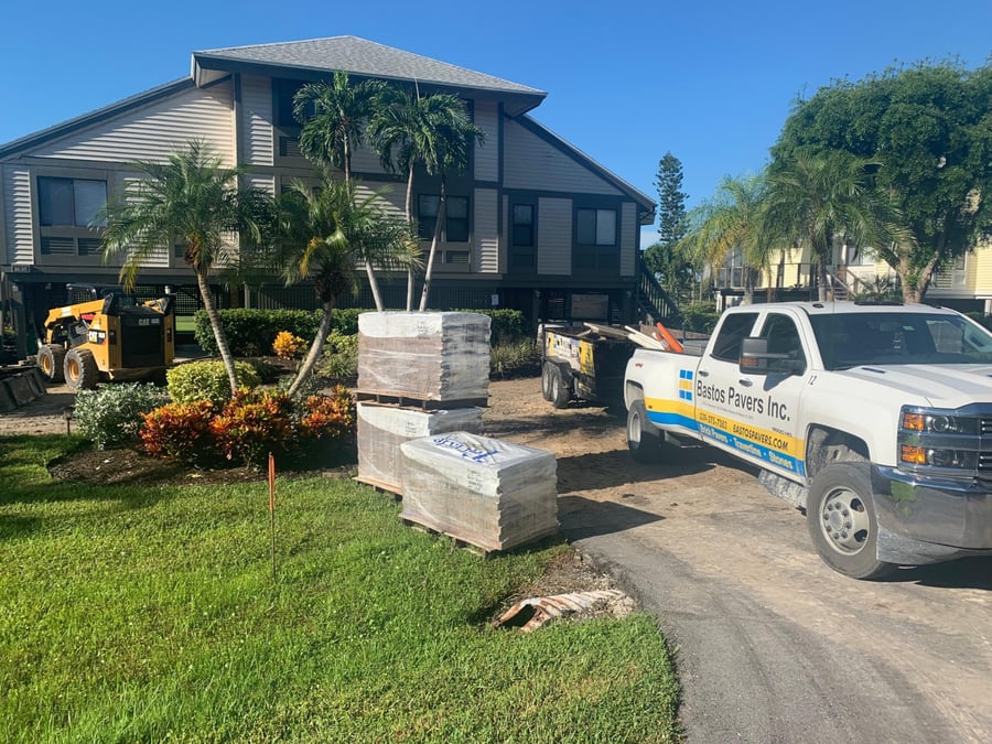 Bastos truck and paver pallets staged at an island condominium project