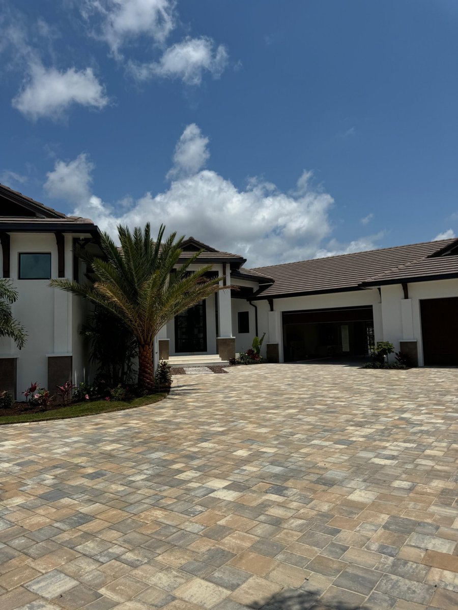 Wide paver motor court at a luxury Naples estate