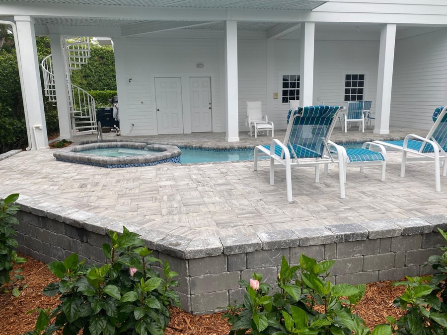 Raised paver pool deck with spa and block seat wall