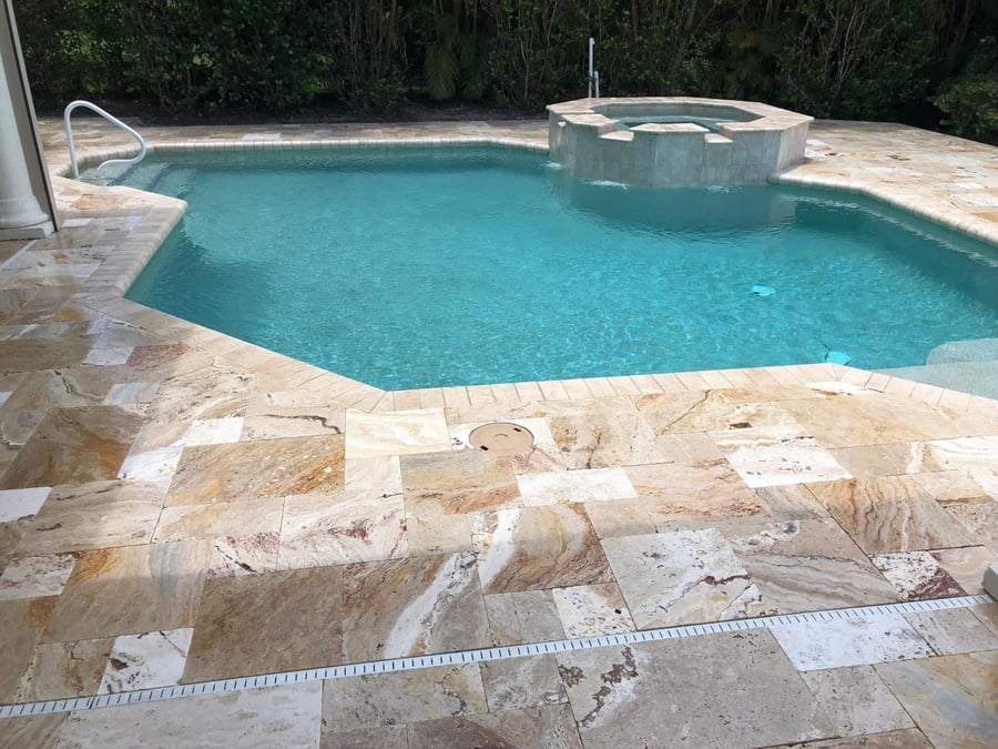 Scabos travertine pool deck with raised spa