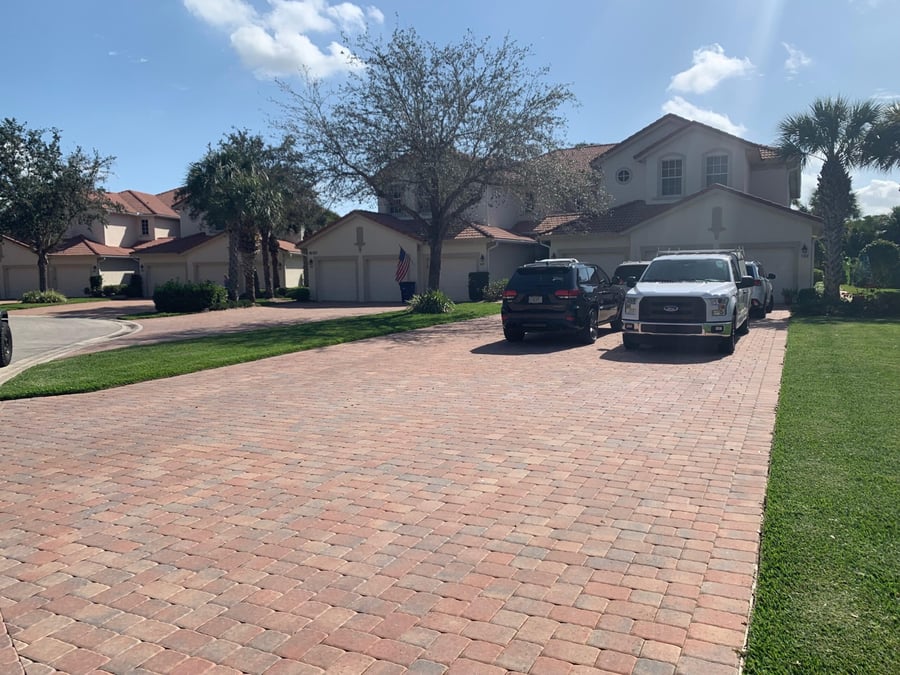 Community paver drive and parking court at a residential complex