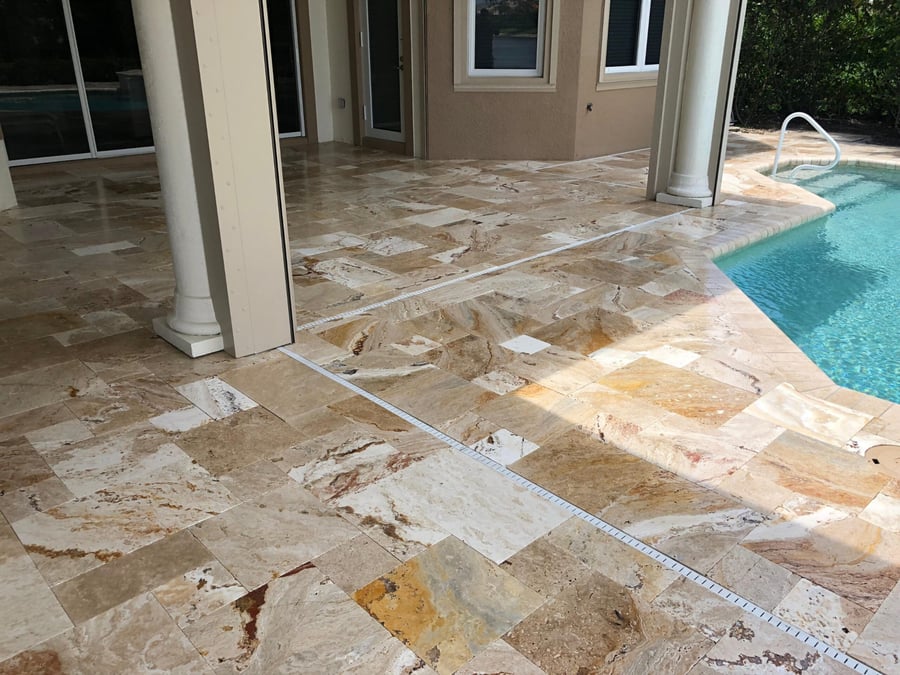 Scabos travertine lanai and pool deck with drain detail